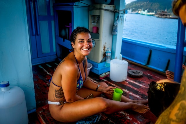 Woman scuba diver on the boat